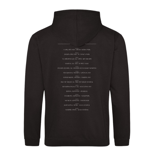 The Corrs 2025 Band Line Up Black Hoodie from The Corrs Store by National Merchandise is shown from the back, with multiple lines of small white text centered down the back against a bright green background.
