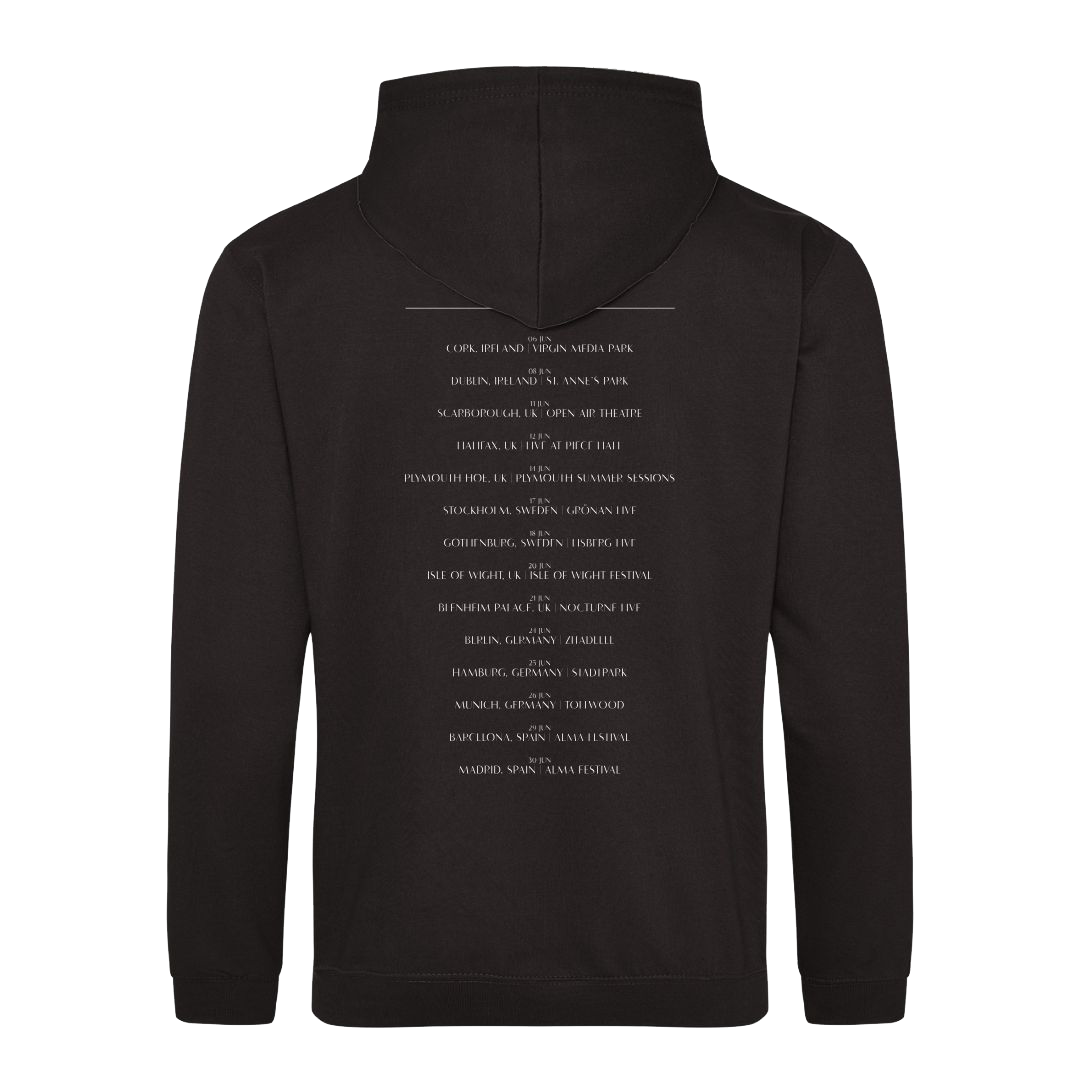 The Corrs 2025 Band Line Up Black Hoodie from The Corrs Store by National Merchandise is shown from the back, with multiple lines of small white text centered down the back against a bright green background.