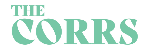 Logo image with the text “THE CORRS” in light green. 